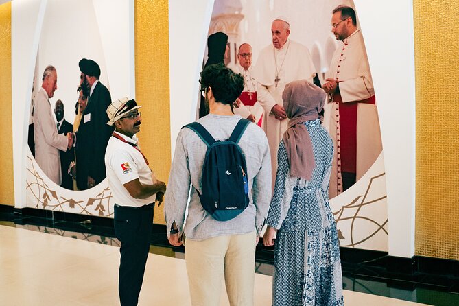 Abu Dhabi Sightseeing Tour: Sheikh Zayed Mosque, Heritage Village & Dates Market - Sheikh Zayed Grand Mosque Center: Dress Code and Photo Time That Actually Fits