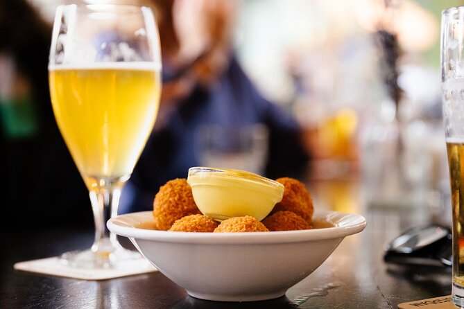 Amsterdam High-End Dutch Food & History Tour - Up to 8 guests - Saturday tastings: Lindengracht satay, farmhouse cheeses, and a cheese-and-wine finale