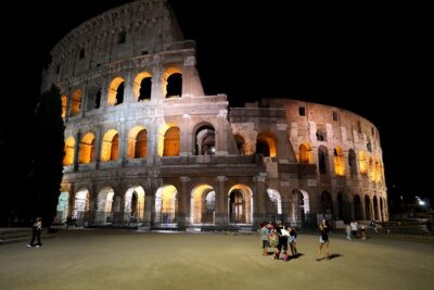 Ancient Rome at Dusk: Guided Walking Tour - Stop 1: Colosseum from the outside after dark