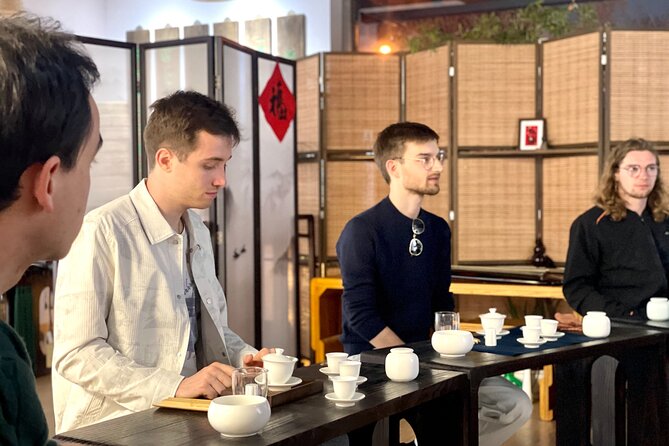 Beijing Culture: Tea Ceremony, Heritage Instrument & Calligraphy - Entering a private Beijing heritage space (not a public show)