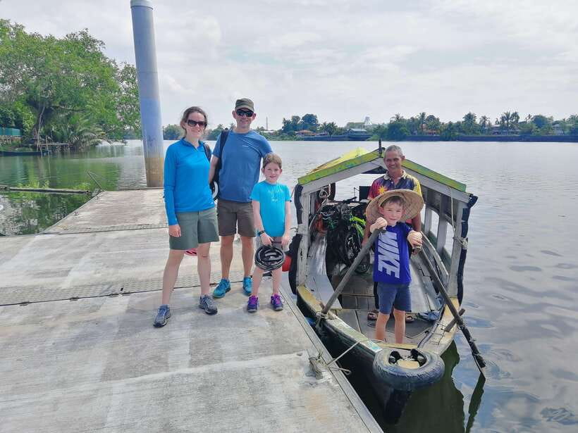 Best of Kuching: Heritage & Kampong Bike Tour - Sarawak River on a traditional sampan: short ride, big shift