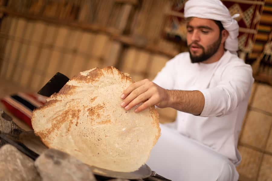 Dubai: Heritage Camel Desert Safari with Traditional Dinner - Inside the Bedouin-style camp: henna, folk dance, and bread-making