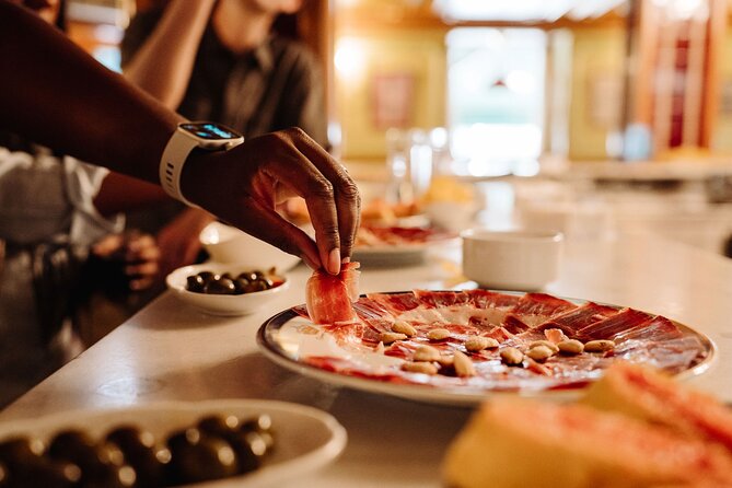 Madrid Tapas & Taverns Small Group Food & History Tour - Stop 3: Mesón del Champiñón for More Bites and a Local Drink Pairing