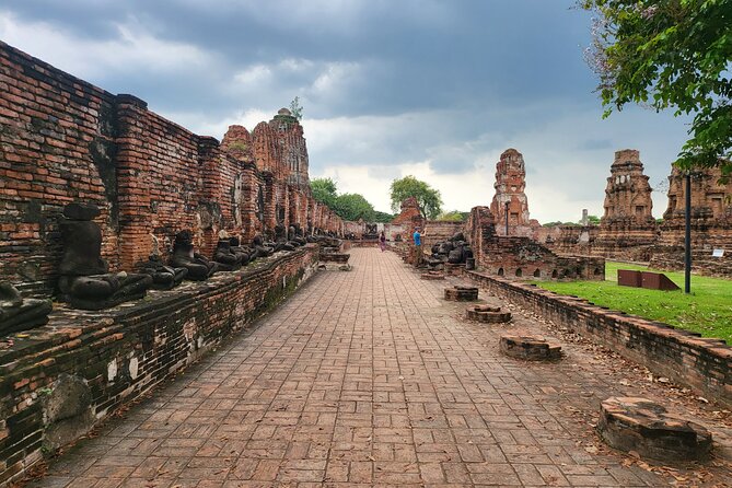 Private tour to Ayutthaya and Boat Tour Heritage Site - Wat Mahathat: the Buddha head in banyan roots