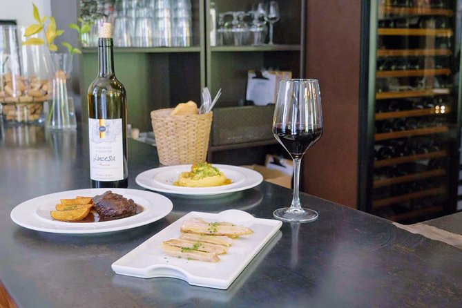 Sevilla Food Tour: Tapas, Wine, History & Traditions - Plaza del Pan and the flamenco traje de flamenca pause