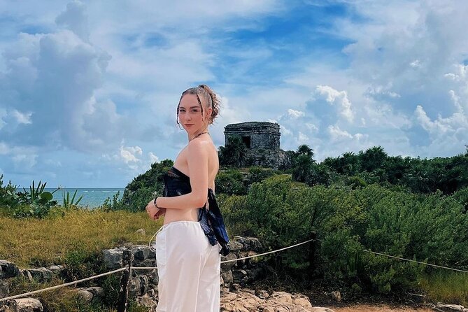 Tulum Excursion: Ancient Ruins + Cenote & Food! From Riviera Maya - Entering Tulum: cliffside Mayan buildings and the El Castillo focus